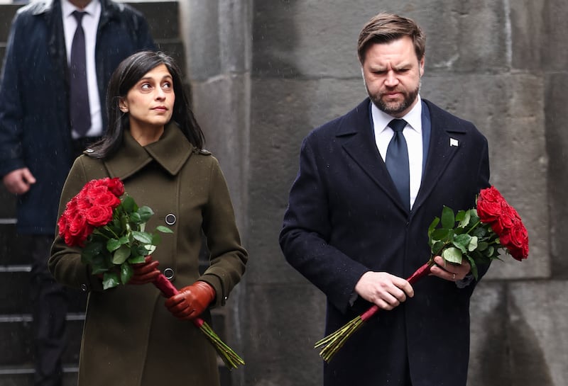 Vance and wife Usha Vance hold flowers as they walk to the Armenian Genocide Memorial.