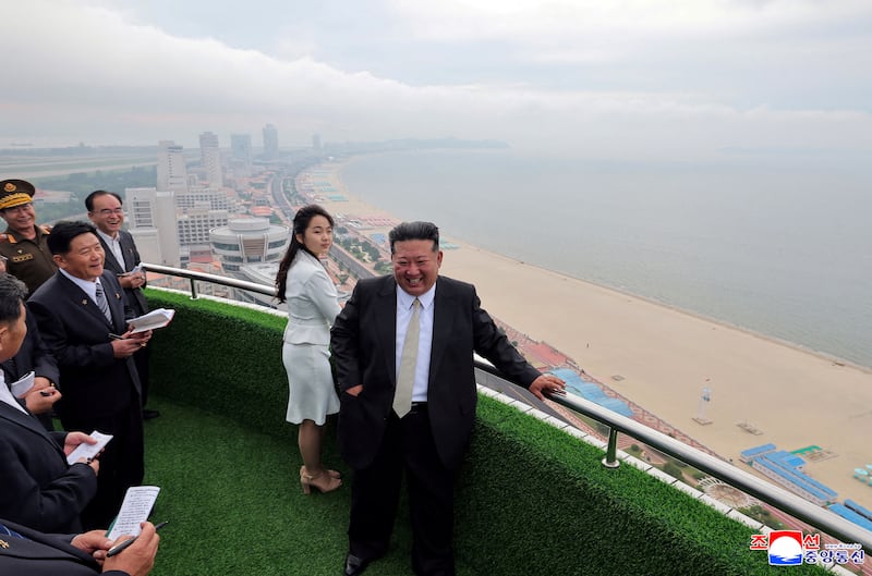 North Korean leader Kim Jong Un and his daughter Kim Ju Ae stand on a balcony facing the beach during a ceremony to celebrate the completion of the Wonsan Kalma Coastal Tourist Zone, in Wonsan, in North Korea, June 24, 2025.  KCNA via REUTERS    ATTENTION EDITORS - THIS IMAGE WAS PROVIDED BY A THIRD PARTY. REUTERS IS UNABLE TO INDEPENDENTLY VERIFY THIS IMAGE. NO THIRD PARTY SALES. SOUTH KOREA OUT. NO COMMERCIAL OR EDITORIAL SALES IN SOUTH KOREA.     TPX IMAGES OF THE DAY