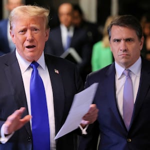 Former U.S. President Donald Trump, alongside his attorney Todd Blanche, speaks to the media as he arrives for his criminal trial for allegedly covering up hush money payments at Manhattan Criminal Court on May 30, 2024 in New York City. Judge Juan Merchan gave the jury their instructions, and deliberations are entering their second day. The former president faces 34 felony counts of falsifying business records in the first of his criminal cases to go to trial.