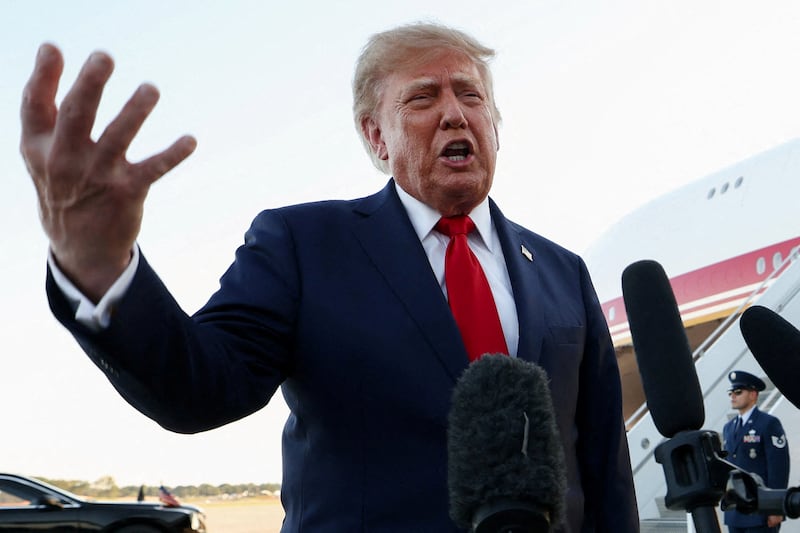 FILE PHOTO: U.S. President Donald Trump speaks to members of the press as he arrives at Charlotte Douglas International Airport, while he travels to attend a campaign rally supporting Republican U.S. Senate candidate Michael Whatley, in Charlotte, North Carolina, U.S., September 16, 2026.  REUTERS/Kevin Lamarque/File Photo