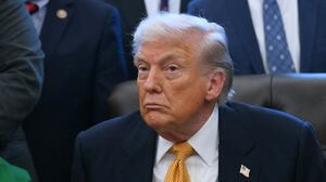 President Donald Trump looks on before signing a bill in the Oval Office of the White House in Washington, DC, on January 14, 2026.