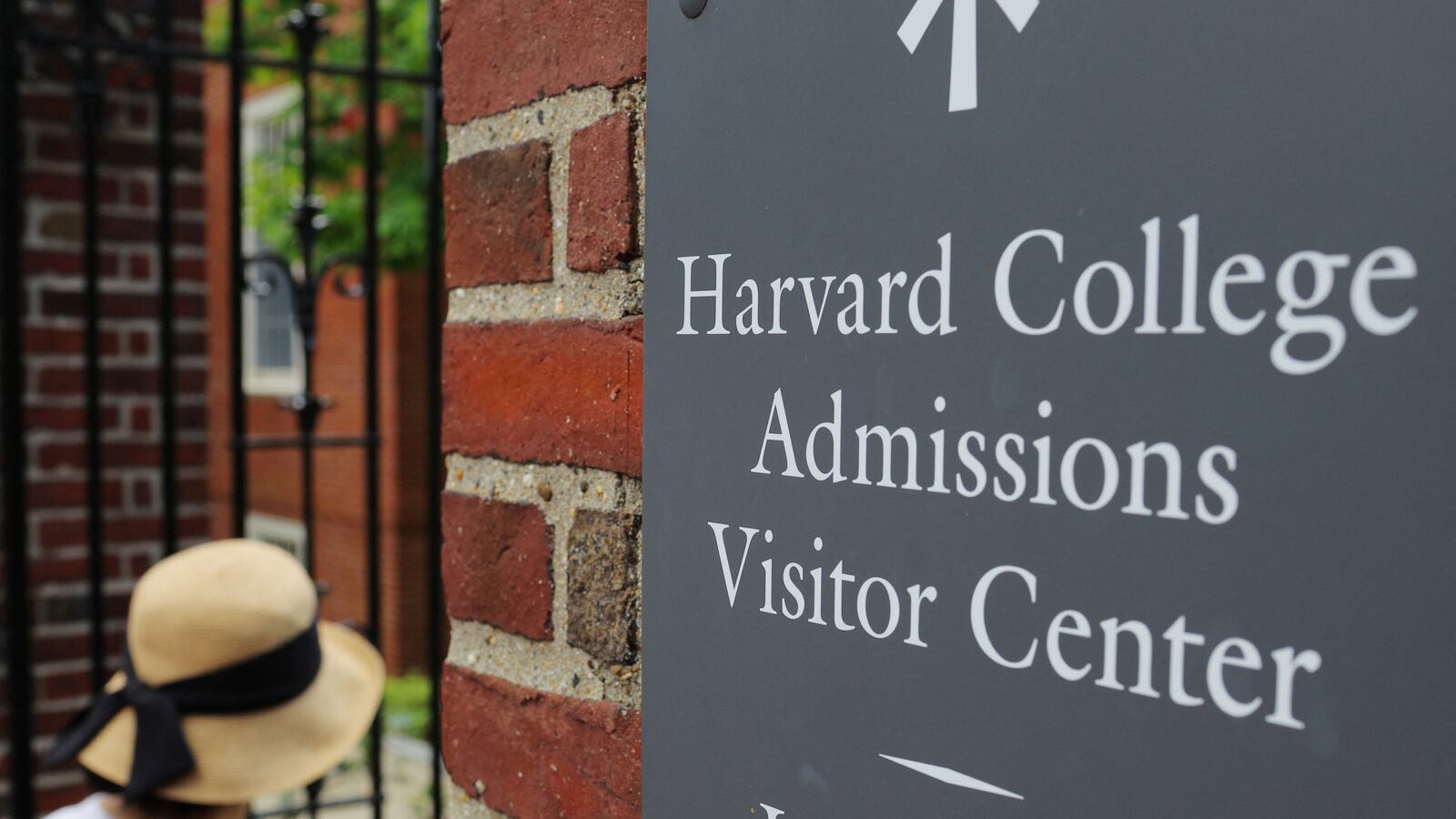 A sign points the way to the Harvard College Admissions Visitors Center at Harvard University in Cambridge, Massachusetts, July 6, 2023.