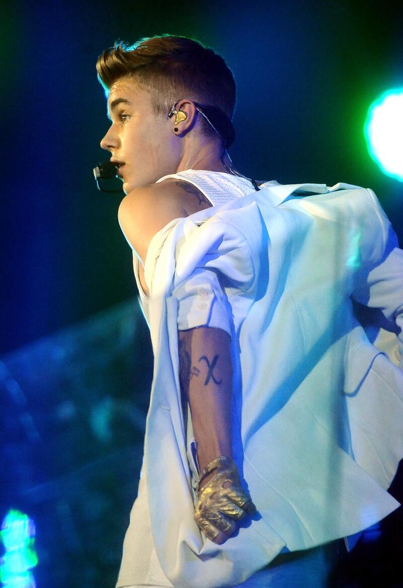 galleries/2013/05/02/justin-bieber-s-tattoos-a-selena-gomez-look-a-like-a-crown-jesus-ink-and-more/130429-justin-bieber-tattoos5_l7rsvf