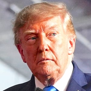 US President Donald Trump holds an Executive Order after signing it onstage during a rally at Pinnacle Bank Expo Center in Grand Island, Nebraska, US, October 5, 2026.