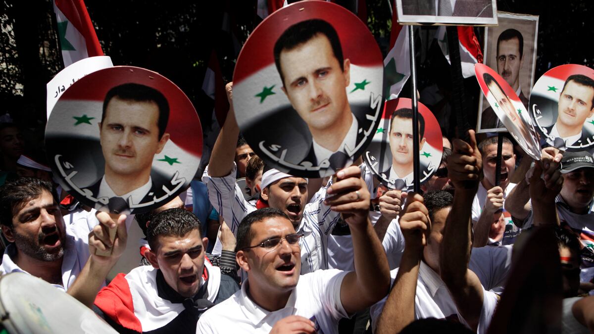 cheats/2011/06/21/at-least-7-dead-in-syrian-protests/syria-rally-supporting-bashar-al-assad-cheat_iws2nv
