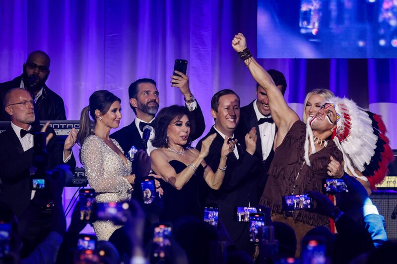 Jeanine Pirro and others watch on stage as The Village People perform YMCA during the Turning Point USA Inaugural-Eve Ball at the Salamander Hotel on Jan. 19, 2025.