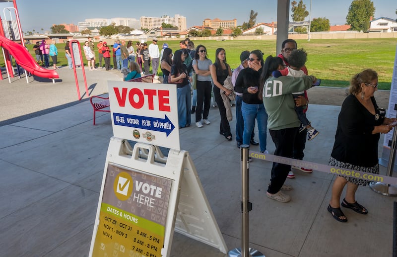 Voters stand in long lines to cast their ballots in the Proposition 50 special election on redistricting at the West Haven Park voting center in Garden Grove on Tuesday, November 4, 2025.