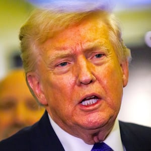 President Donald Trump gaggles with reporters while in-flight aboard Air Force One on February 6, 2026 in Palm Beach, Florida.