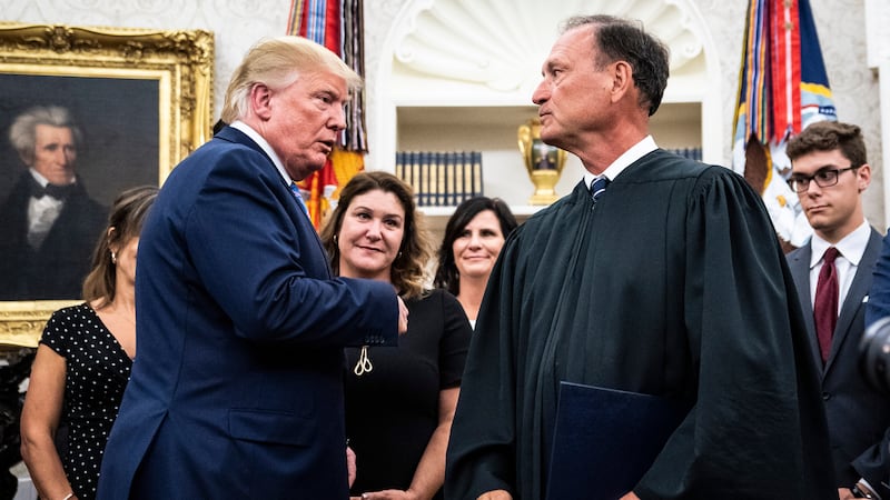 President Donald J. Trump greets Associate Justice of the Supreme Court Samuel Alito as he departs from a ceremony to swear in Secretary of Defense Mark Esper in the Oval Office at the White House on Tuesday, July 23, 2019 in Washington, DC.