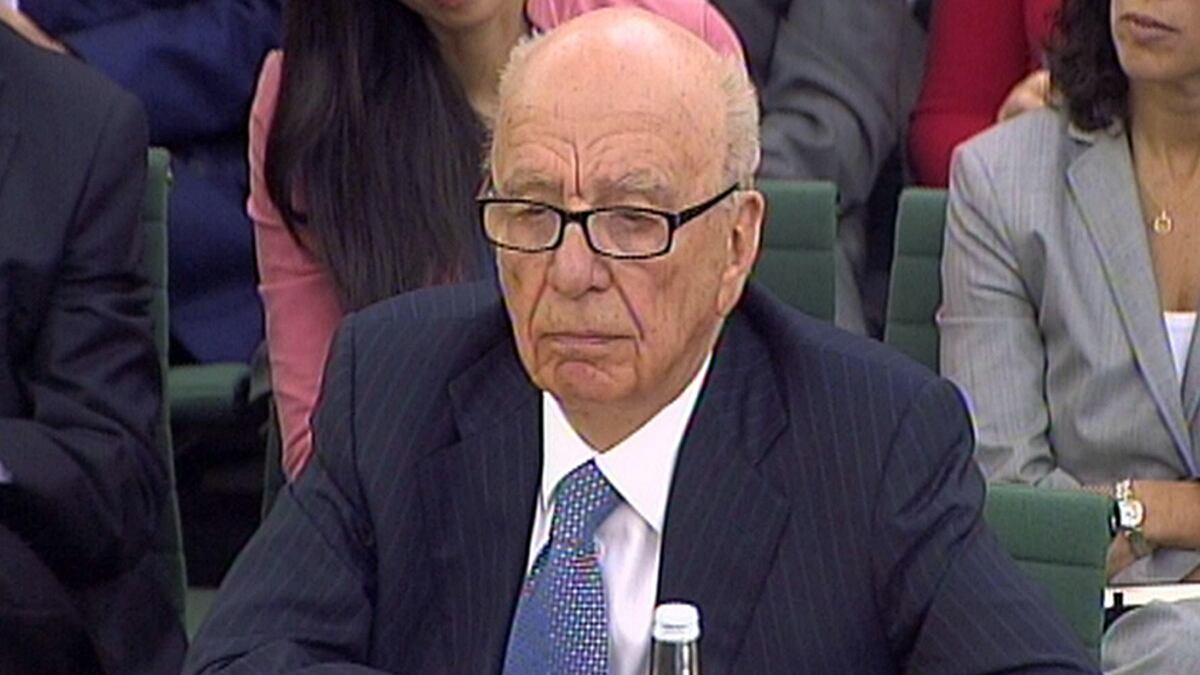 articles/2011/07/19/murdoch-scandal-rupert-murdoch-s-know-nothing-strategy/murdoch-humble-robertson_jmgsaq