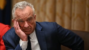 US Secretary of Health and Human Services Robert F. Kennedy Jr., look on as President Donald Trump speaks during a Cabinet Meeting in the Cabinet Room of the White House in Washington, DC on December 2, 2025. (Photo by ANDREW CABALLERO-REYNOLDS / AFP via Getty Images)