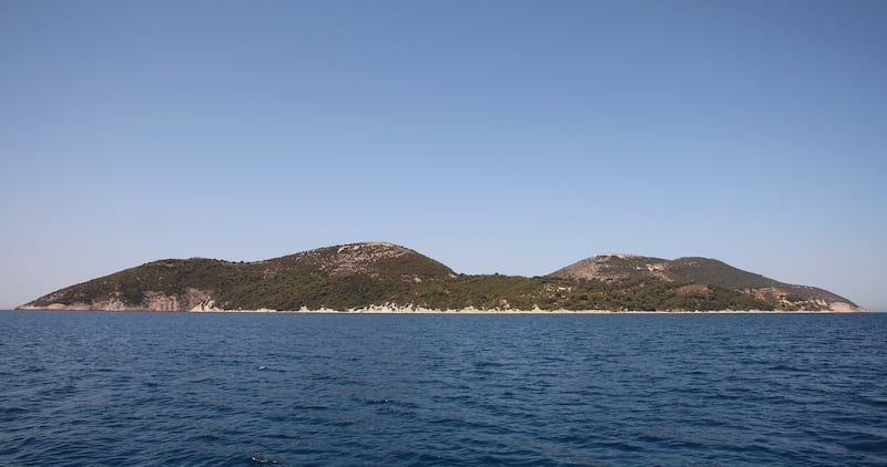 TO GO WITH AFP STORY BY BRISEIDA MEMA
A picture taken on July 31, 2015 shows a general view of the island of Sazan, some 140 km southwest of Albania's capital Tirana, on July 31, 2015. Once communist Albania's most secret military base, a "sentinel" of the Adriatic Sea, the Sazan island has opened to tourists its bunkers and tunnels amid wildness that authorities hope to turn into an attraction. AFP PHOTO / GENT SHKULLAKU (Photo credit should read GENT SHKULLAKU/AFP via Getty Images)