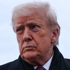 White House Chief of Staff Susie Wiles walks as U.S. President Donald Trump speaks with reporters, after he disembarked Air Force One on his return from Dover, Delaware, at Joint Base Andrews, Maryland, U.S., December 17, 2025. REUTERS/Jonathan Ernst