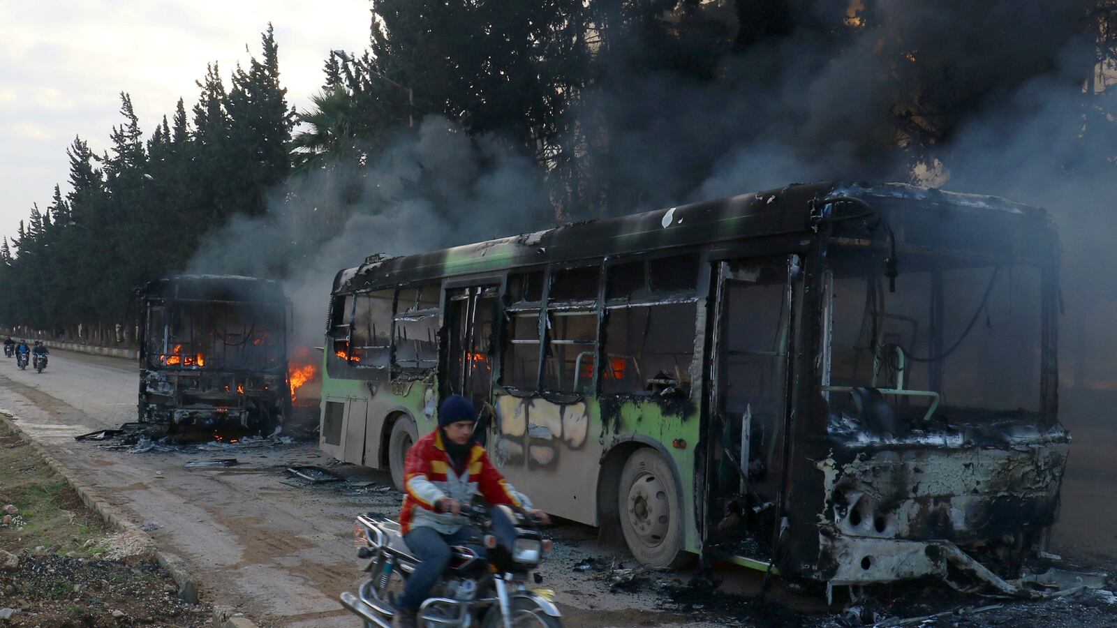 cheats/2016/12/18/report-syrian-rebels-burn-evacuation-buses/161218-syria-buses-cheat_fugmyp