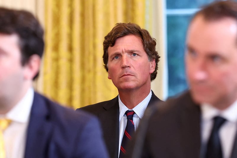 Tucker Carlson looks on during U.S. President Donald Trump's meeting with an oil industry executives, at the White House in Washington, D.C., U.S., January 9, 2026. REUTERS/Kevin Lamarque