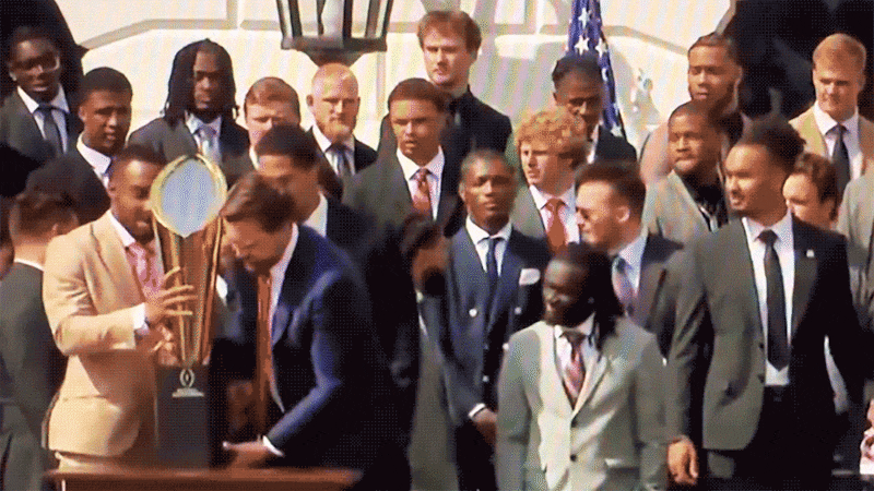Vice President, JD Vance, breaks the CFP National Championship Trophy at a reception at the white house