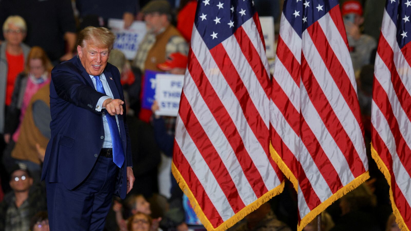 Donald Trump gestures during a campaign rally in Claremont, New Hampshire