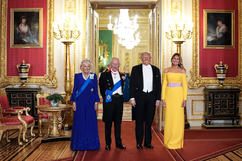 TOPSHOT - (L-R) Britain's Queen Camilla, Britain's King Charles III, US President Donald Trump and US First Lady Melania Trump pose for a photo as they attend a State Banquet at Windsor Castle, in Windsor, on September 17, 2025, during the US President's second State Visit. US President Donald Trump arrived in Britain for an unprecedented second State Visit, with the UK government rolling out a royal red carpet welcome to win over the mercurial leader. (Photo by Doug MILLS / POOL / AFP) (Photo by DOUG MILLS/POOL/AFP via Getty Images)