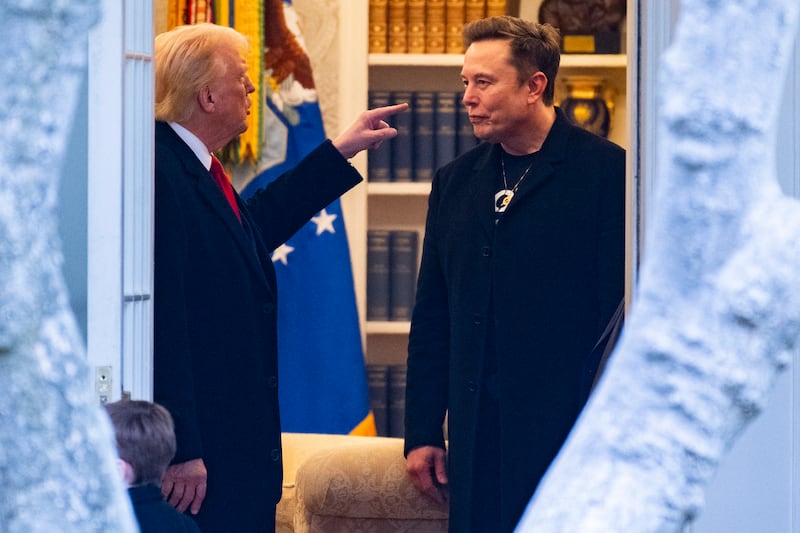 Donald Trump and Elon Musk (R) speak in Mar-a-Lago in Florida on March 14, 2025. Trump is spending the weekend at his Florida Mar-a-Lago resort.