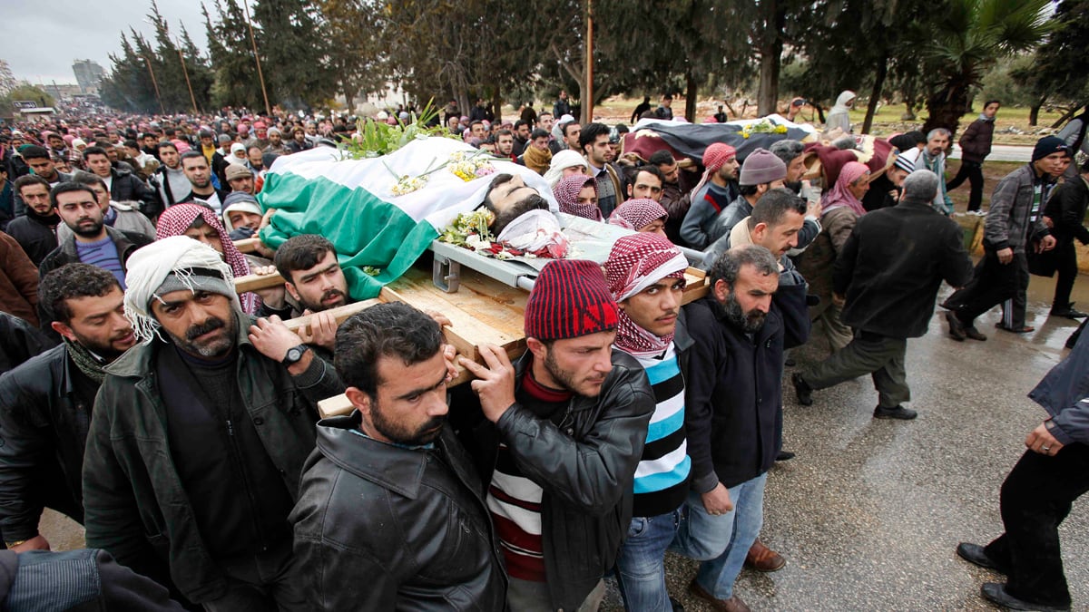 cheats/2012/02/09/tanks-amass-outside-homs/syria-funeral-cs_wt9blx