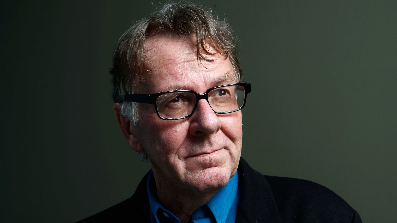 A portrait of Tom Wilkinson.