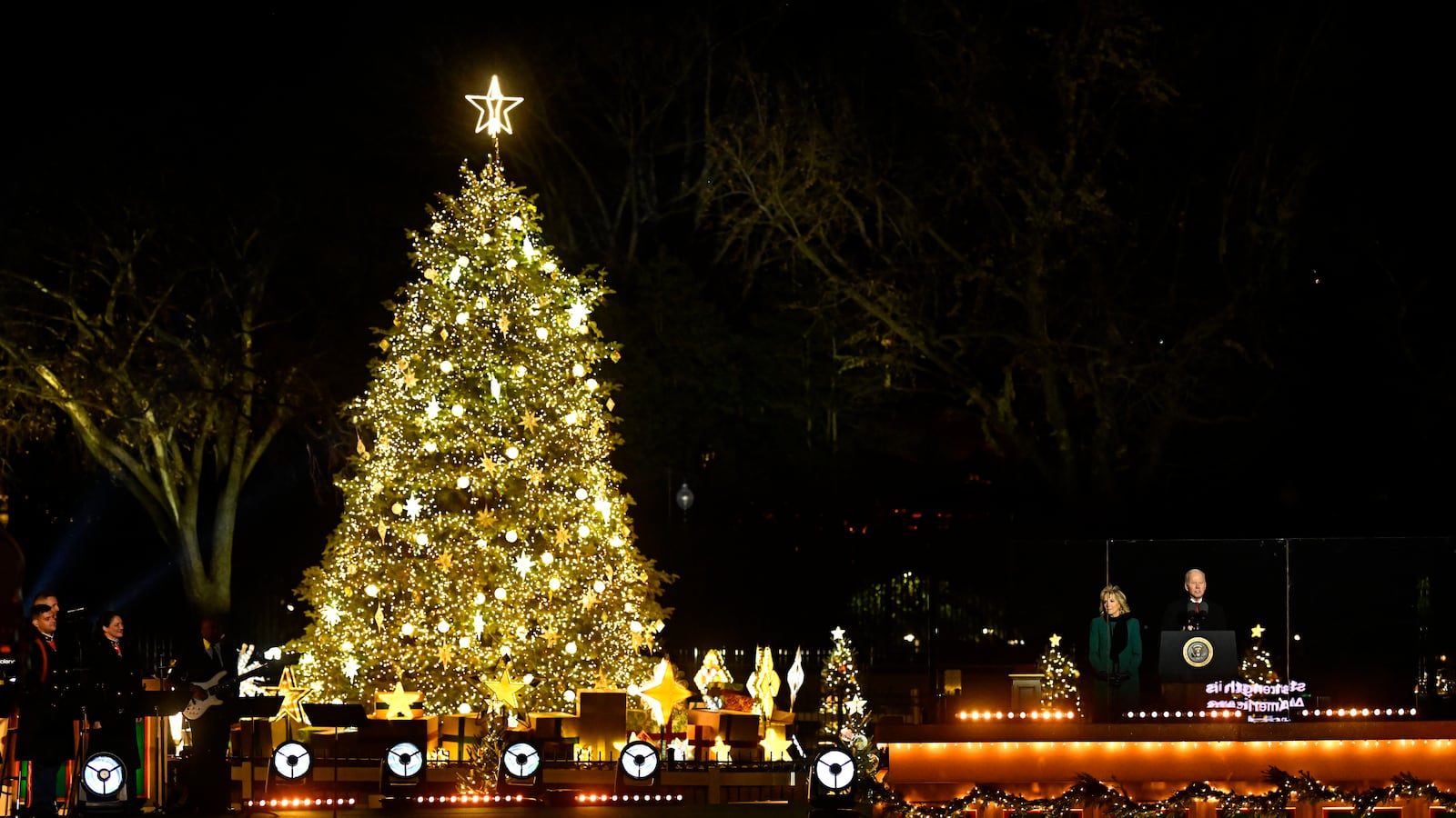First Lady Jill Biden and President Joe Biden talk during the 100th National Christmas Tree Lighting Ceremony November 30, 2022 in Washington, DC.