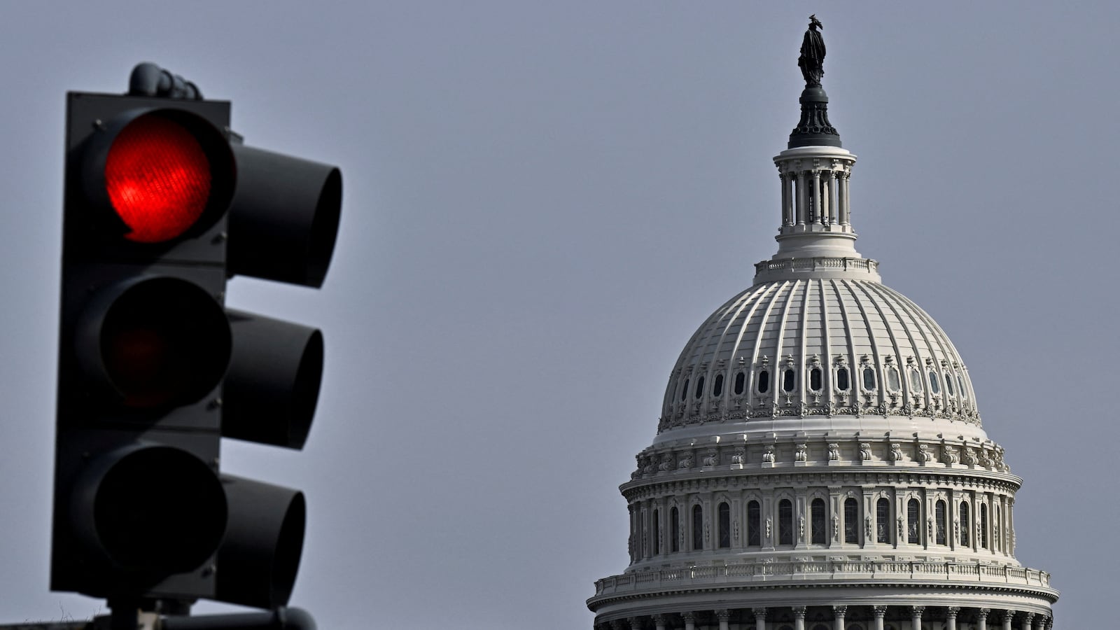 U.S. Capitol building and a red light traffic signal in Washington.