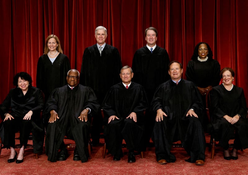 FILE PHOTO: U.S. Supreme Court justices pose for their group portrait at the Supreme Court in Washington, U.S., October 7, 2022. Seated (L-R): Justices Sonia Sotomayor, Clarence Thomas, Chief Justice John G. Roberts, Jr., Samuel A. Alito, Jr. and Elena Kagan. Standing (L-R): Justices Amy Coney Barrett, Neil M. Gorsuch, Brett M. Kavanaugh and Ketanji Brown Jackson. REUTERS/Evelyn Hockstein      TPX IMAGES OF THE DAY/File Photo