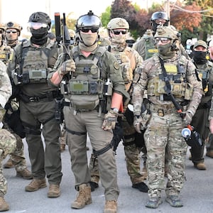 Border Patrol Chief Gregory Bovino of the El Centro Sector stands amid a protest outside an ICE facility