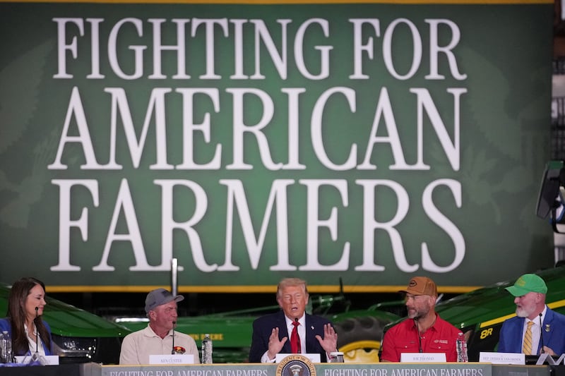 U.S. President Donald Trump delivers remarks next to Ken Custer and Joe Thomas during an event at Custer Farms in Chippewa Falls, Wisconsin, U.S., June, 5, 2026. REUTERS/Nathan Howard