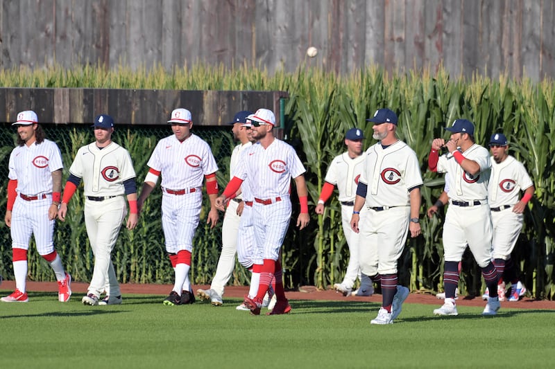 Aug 11, 2022; Dyersville, Iowa, USA; The Chicago Cubs and Cincinnati Reds walk onto the field before playing at Field of Dreams. Mandatory Credit: Jeffrey Becker-USA TODAY Sports