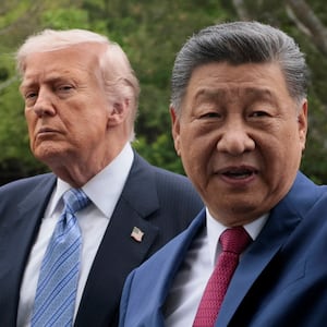 Chinese President Xi Jinping gestures as he greets U.S. President Donald Trump at Zhongnanhai Garden in Beijing, China, May 15, 2026.