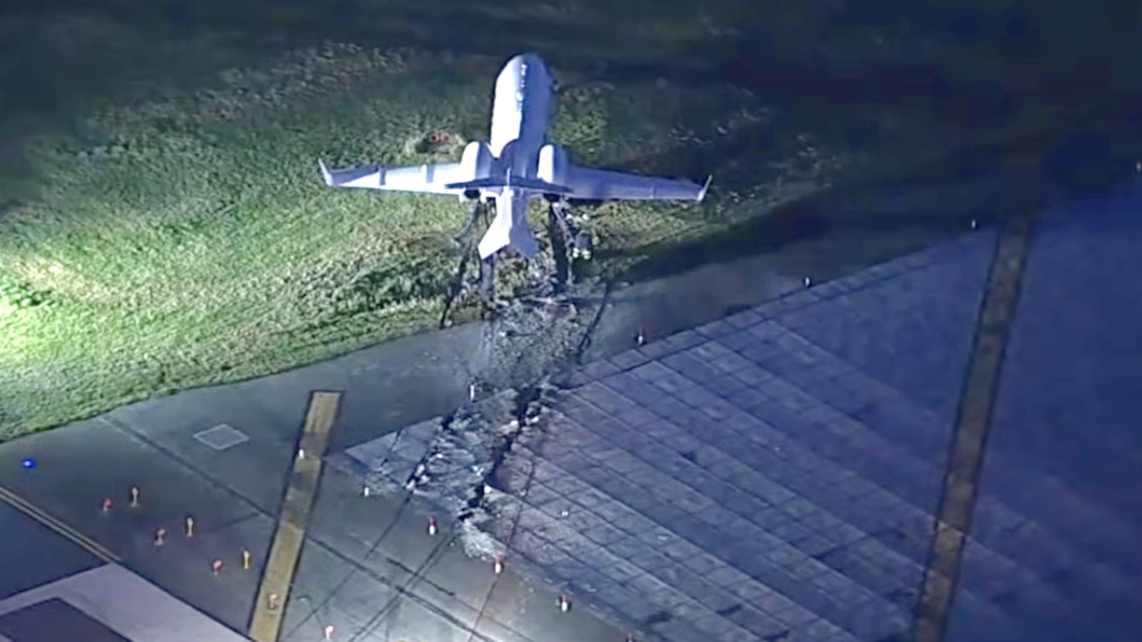 View of a plane that has skidded off a runway.