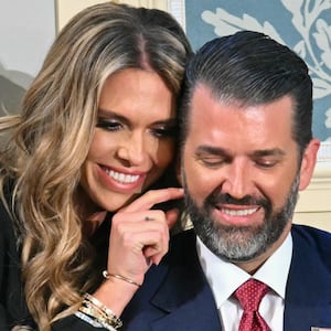 Donald Trump Jr. (R) sits with Bettina Anderson ahead of US President Donald Trump's address to a joint session of Congress in the House Chamber of the US Capitol in Washington, DC, on March 4, 2025.
