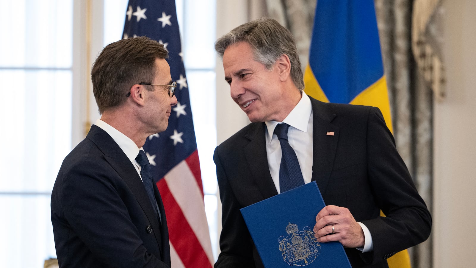 US Secretary of State Antony Blinken receives the NATO ratification documents from Swedish Prime Minister Ulf Kristersson