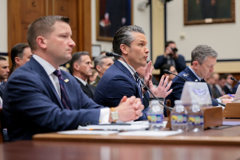 U.S. Defense Secretary Pete Hegseth, flanked by Chairman of the Joint Chiefs of Staff General Dan Caine and Under Secretary of Defense (Comptroller)/Chief Financial Officer Jules W. Hurst, testifies before a House Armed Services Committee hearing on the Department of Defense's FY27 budget request on Capitol Hill in Washington, D.C., U.S., April 29, 2026. REUTERS/Kylie Cooper