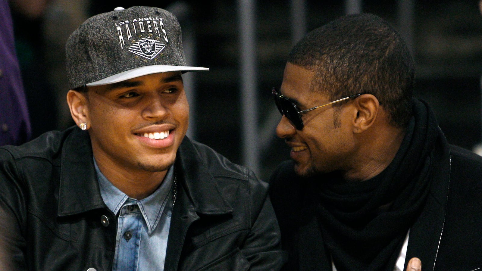 Recording artists Chris Brown (L) and Usher (R)