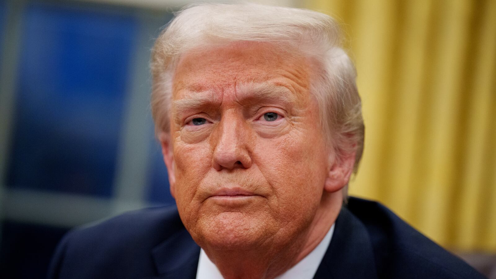 President Donald Trump takes a question from a reporter in the White House.