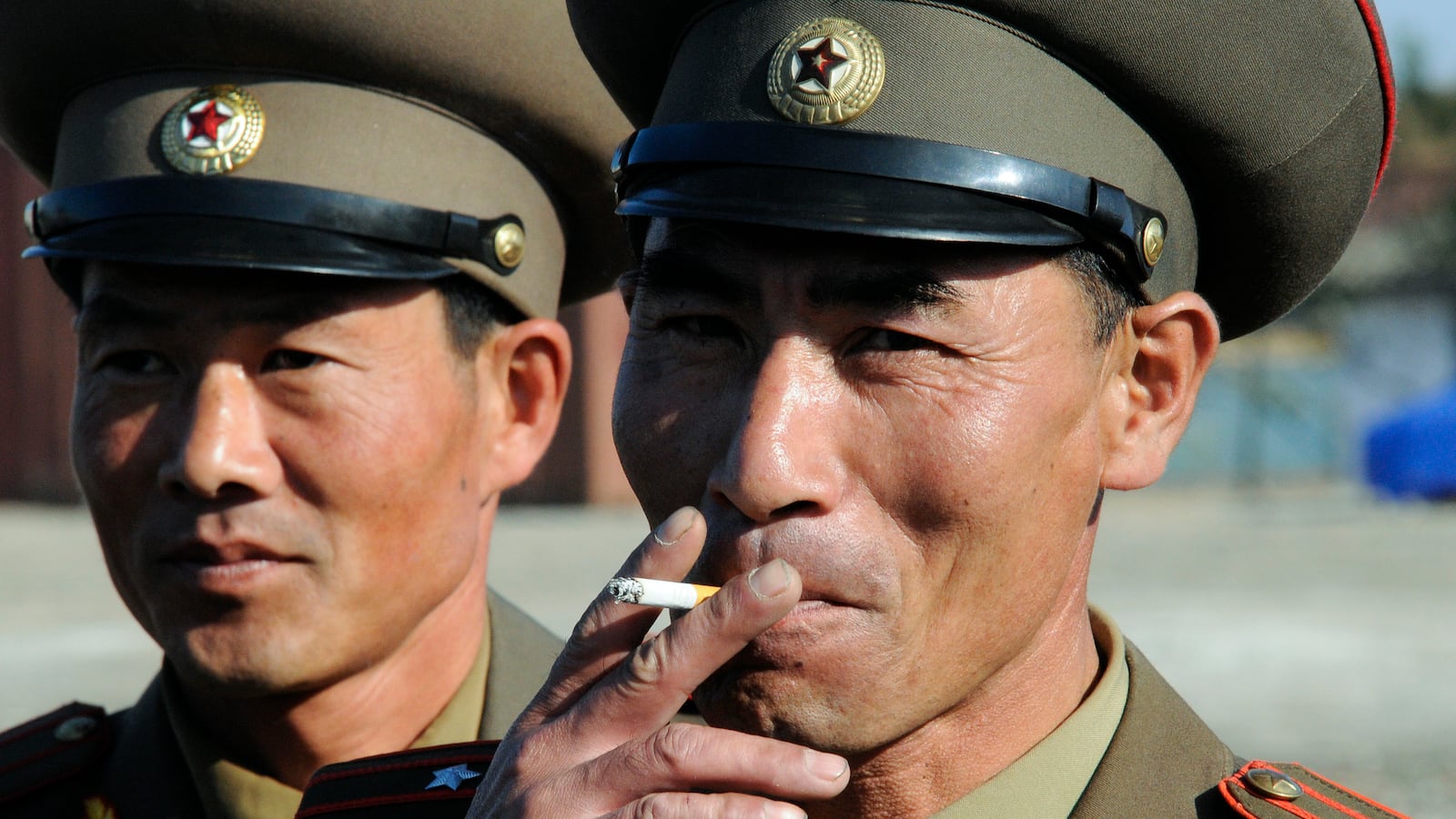 A North Korean military officer smoking a cigarette.