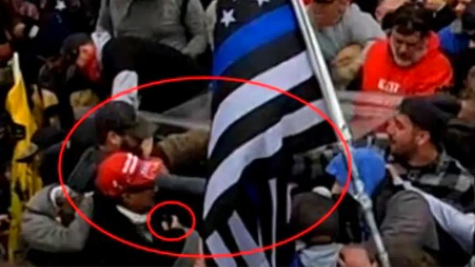 A picture of Daniel Rodriguez wearing a MAGA hat among the mob of Jan. 6 rioters.