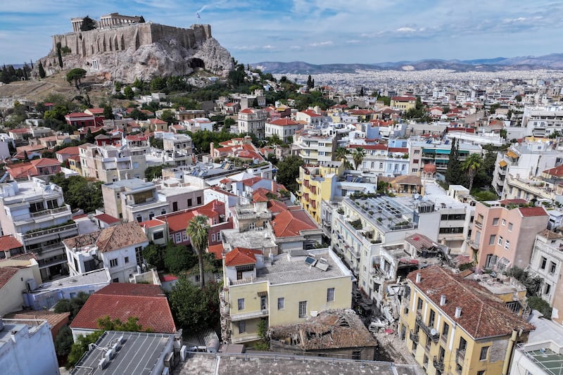 A drone view shows an old building, partially collapsed following an explosion, in the Plaka area, which is popular with tourists, with the Acropolis seen in the background, in central Athens, Greece, September 25, 2026.