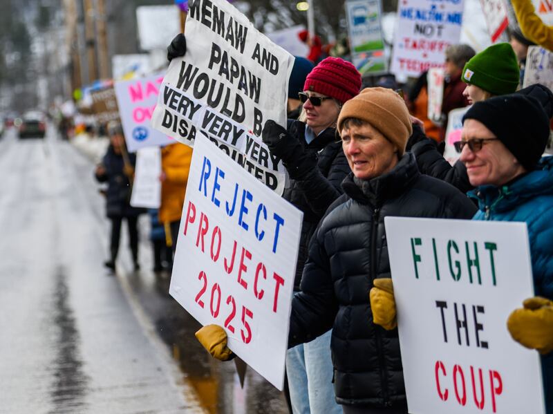 Demonstrators line Route 100 in Waitsfield, Vermont, to protest the visit of Vice President J.D. Vance to Vermont on a ski vacation at nearby Sugarbush Ski Area in Warren, VT. (Photo by: John Lazenby/UCG/Universal Images Group via Getty Images)