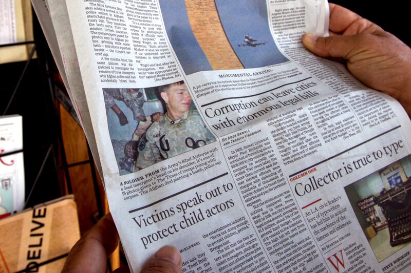 articles/2012/04/20/my-father-s-war-pictures-and-mine/controversial-photos-tease_wsktca