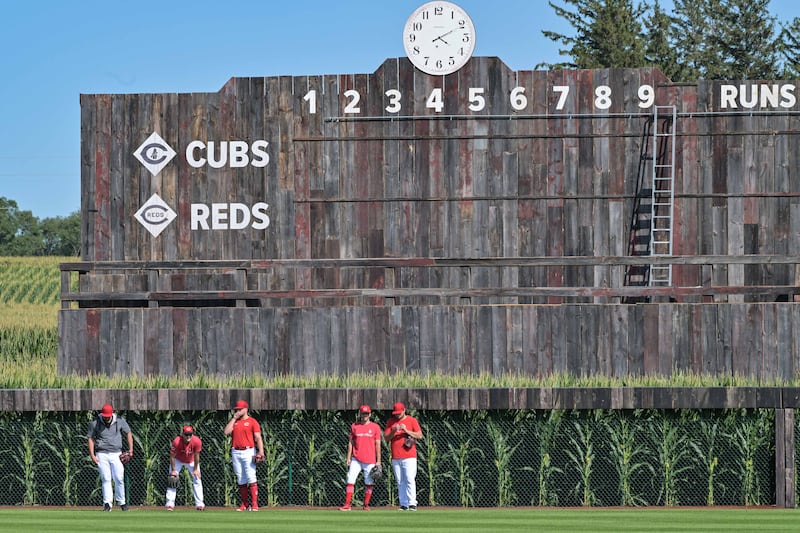 Aug 11, 2022; Dyersville, Iowa, USA; Cincinnati Reds players mingle on the field before the game against the Chicago Cubs at Field of Dreams. Mandatory Credit: Jeffrey Becker-USA TODAY Sports