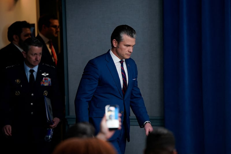 U.S. Secretary of Defense Pete Hegseth and Chairman of the Joint Chiefs of Staff General Dan Caine arrive to a briefing amid the U.S.-Israeli conflict with Iran, at the Pentagon in Washington, D.C., U.S., March 2, 2026. REUTERS/Elizabeth Frantz