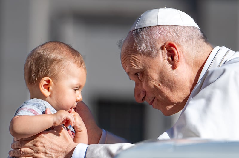 Pope Leo XIV blesses a child as he attends a Jubilee audience at Saint Peter's Square in The Vatican on September 6, 2025.