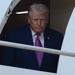 U.S. President Donald Trump disembarks Air Force One, in Charlottesville, Virginia, U.S., April 10, 2026. REUTERS/Evelyn Hockstein