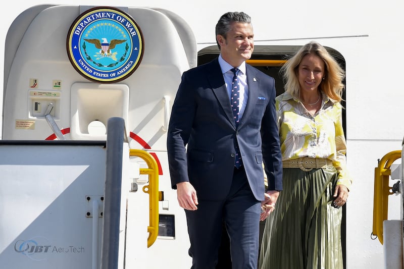 US Secretary of Defense Pete Hegseth (L) and his wife Jennifer Rauchet (R) arrive at Las Americas International Airport in Punta Caucedo, near Santo Domingo, Dominican Republic on November 26, 2025.
