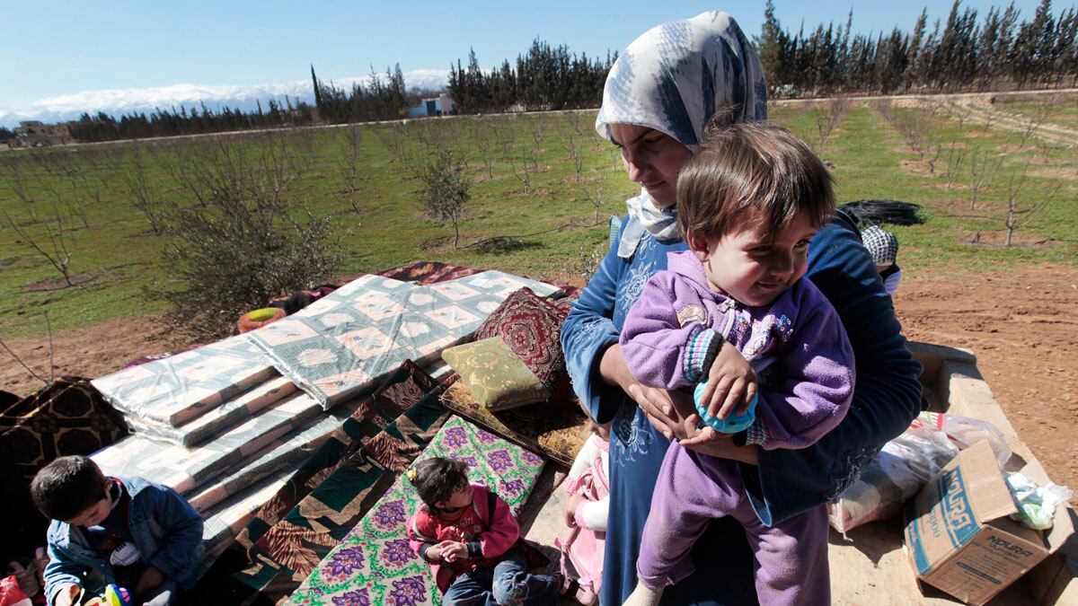 articles/2012/03/08/syrians-flee-across-lebanon-border-as-regime-forces-finish-cleaning-operation/syria-homs-refugees-paul_yp5vhx