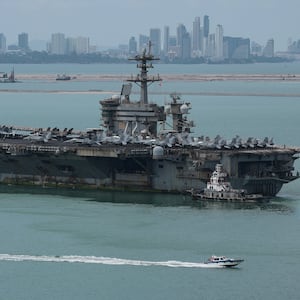 The U.S. Navy Nimitz-class aircraft carrier USS Abraham Lincoln sails toward Laem Chabang Port before docking for a rest stop following a long deployment in the Middle East, with the Pattaya skyline in backdrop, in Chonburi province, Thailand, September 2, 2026. REUTERS/Chalinee Thirasupa